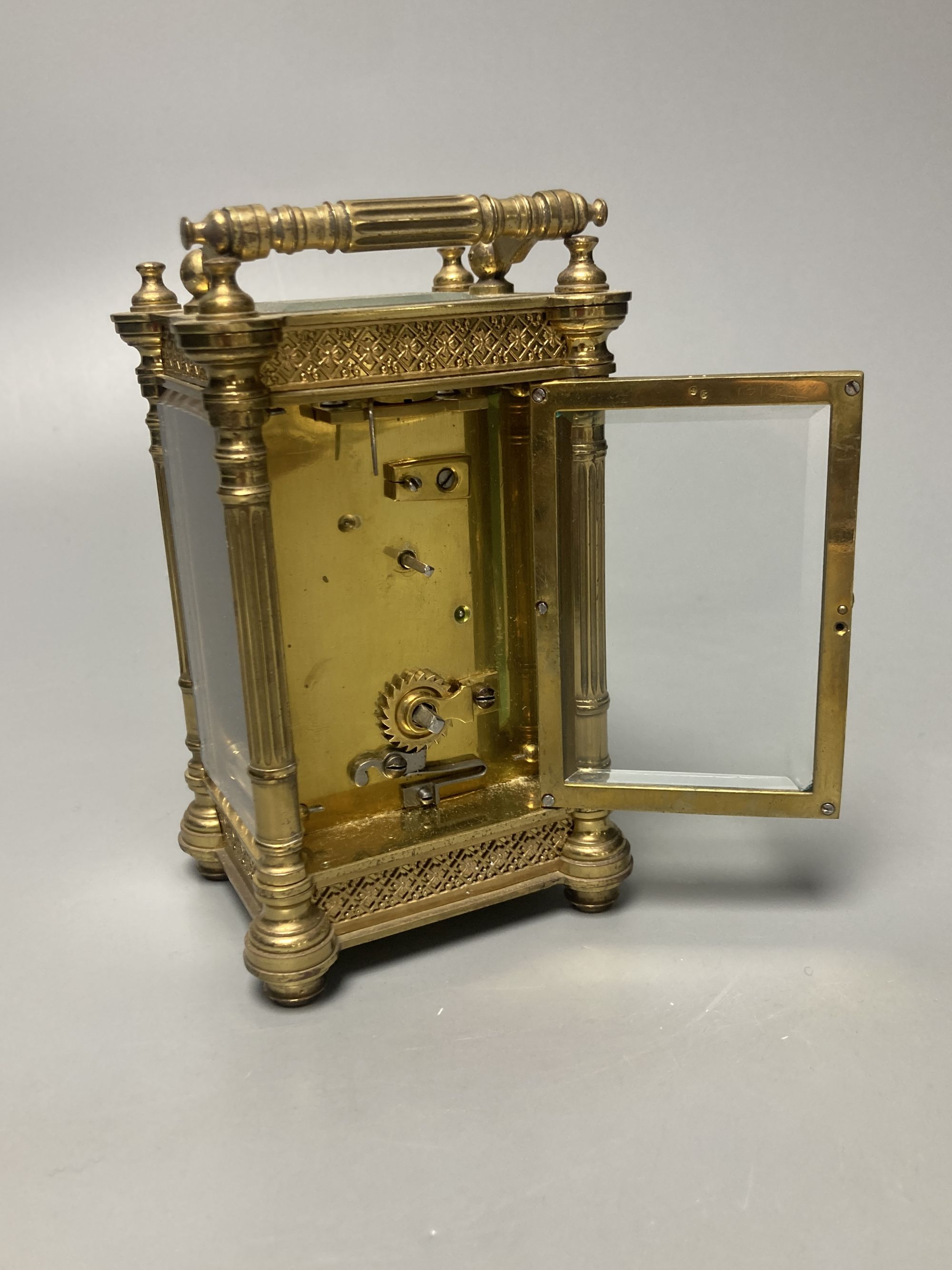 An early 20th century French ornate brass carriage timepiece, height 13cm